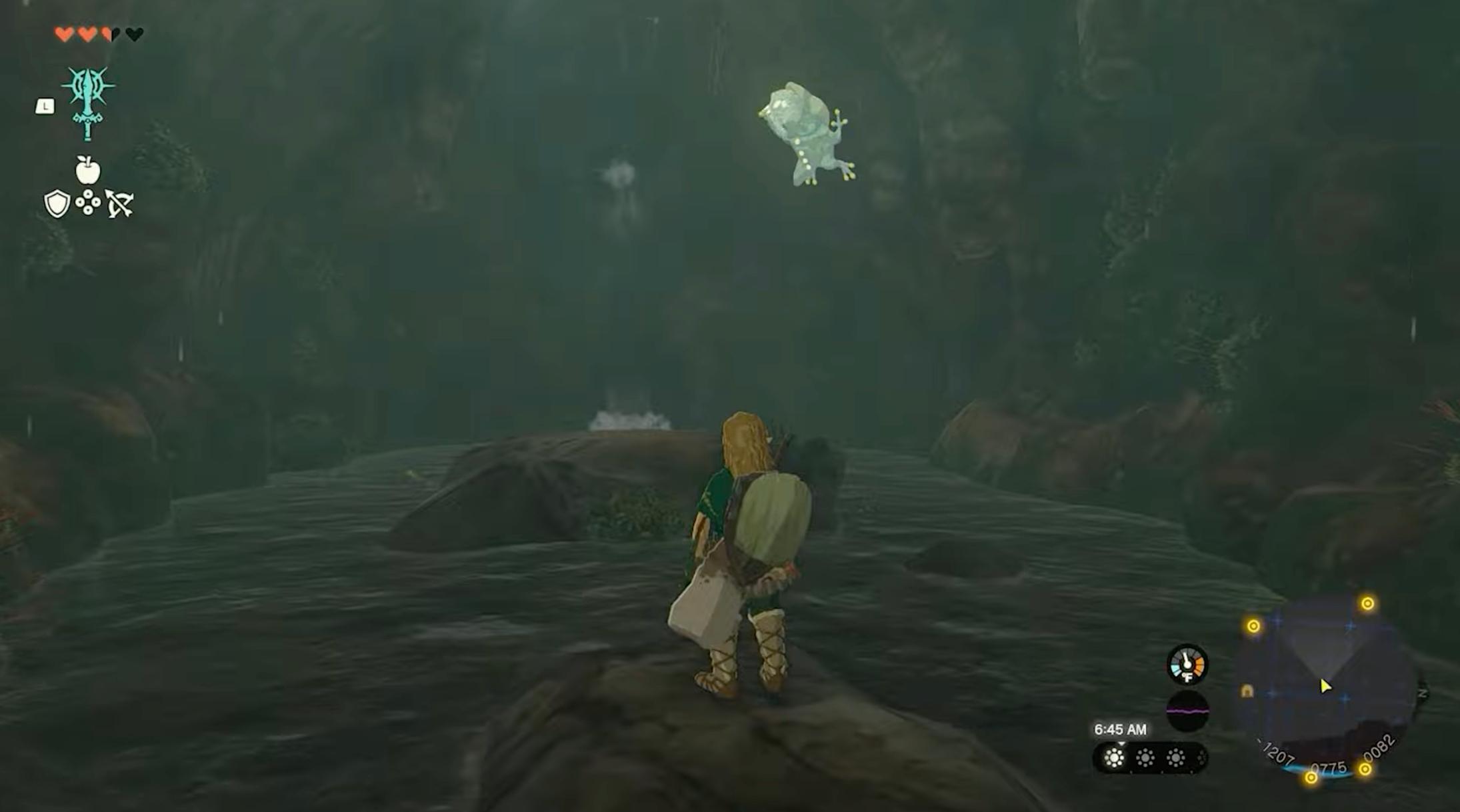 Link, der ser på en Bubbulfrog i en hule i 'Tears of the Kingdom'.