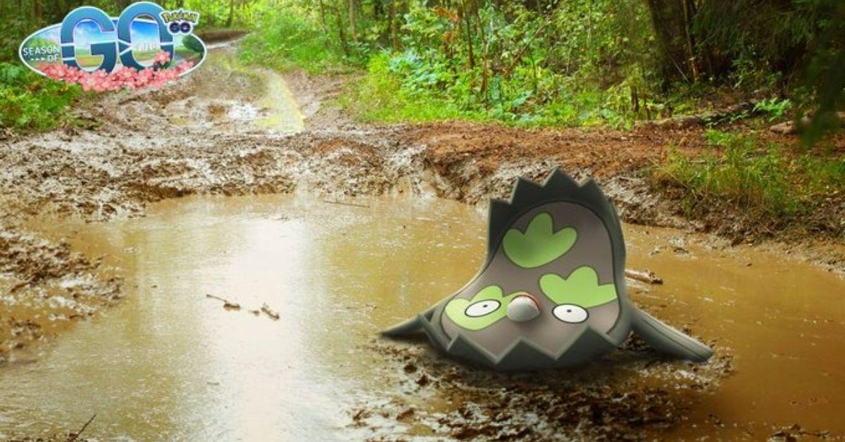 Stunfisk di Pokémon GO seduto in una pozzanghera di fango.