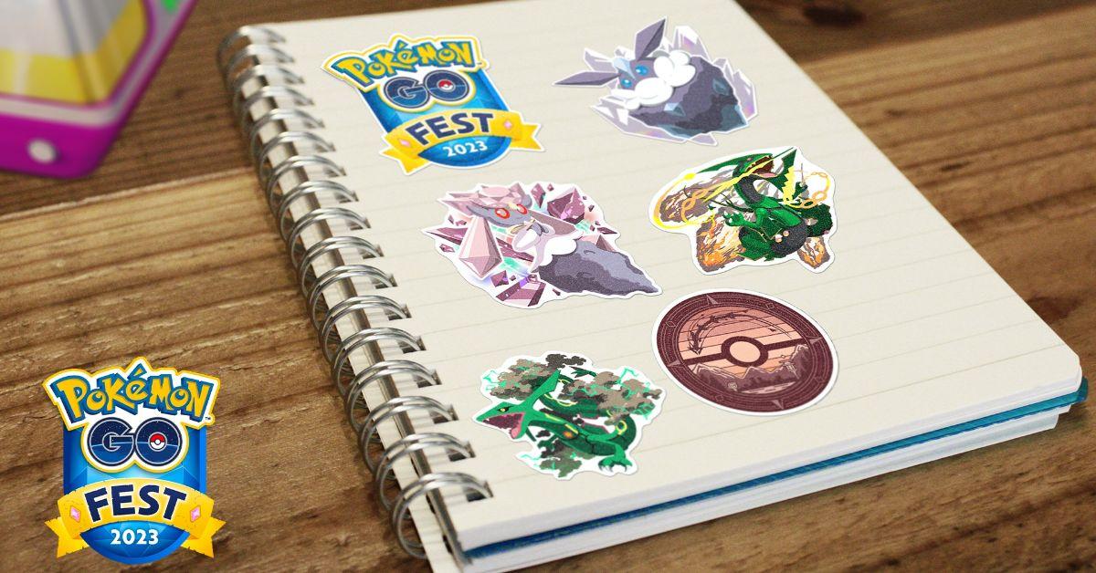 En spiralanteckningsbok med Pokémon GO Fest 2023-klistermärken.