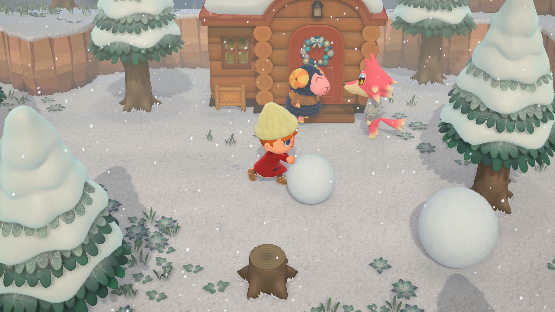 《动物之森：新地平线》中的角色在冬季推雪球。
